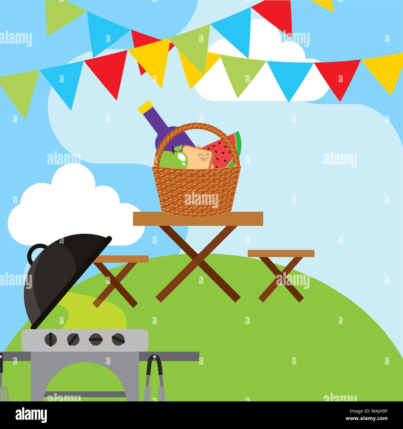 picnic grill and wooden table with wicker basket full food and garland ...