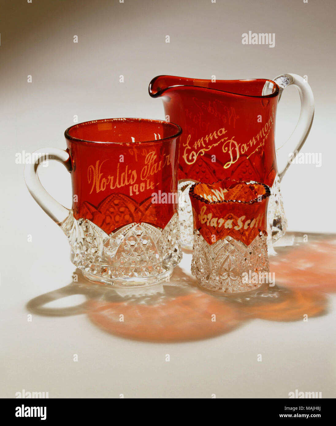 Ruby flash Pressed glass toothpick holder with flared and scalloped rim, engraved 'Clara Scott.' Title: 1904 World's Fair Souvenir Glass Toothpick Holder  . 1904. McGee and Brothers Stock Photo