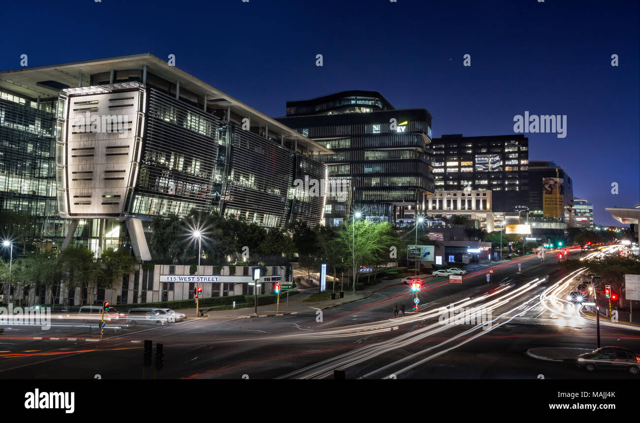 Johannesburg, South Africa, March 29-2018: Busy city street with modern buildings in skyline. Long exposure of city street. Stock Photo