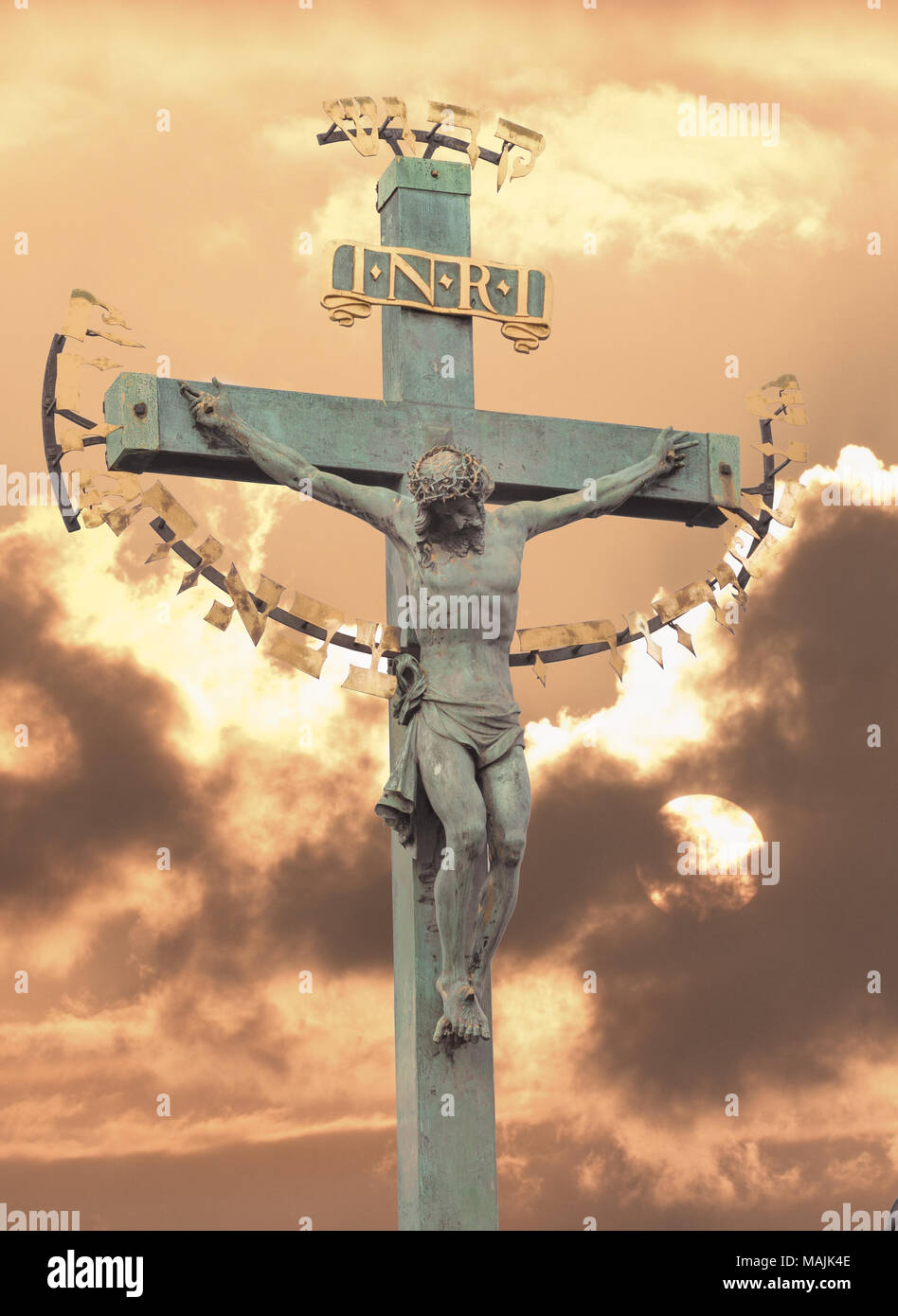 Jesus Christ on cross sunset Stock Photo