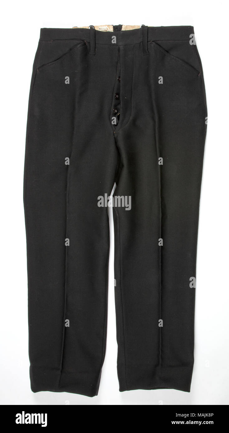 Men's black wool trousers. The inside are marked 'June 19, 1901 Willard,' possibly indicating that these trousers were part of a wedding ensemble. Title: Men's Black Wool Trousers  . between 1900 and 1901. Stock Photo