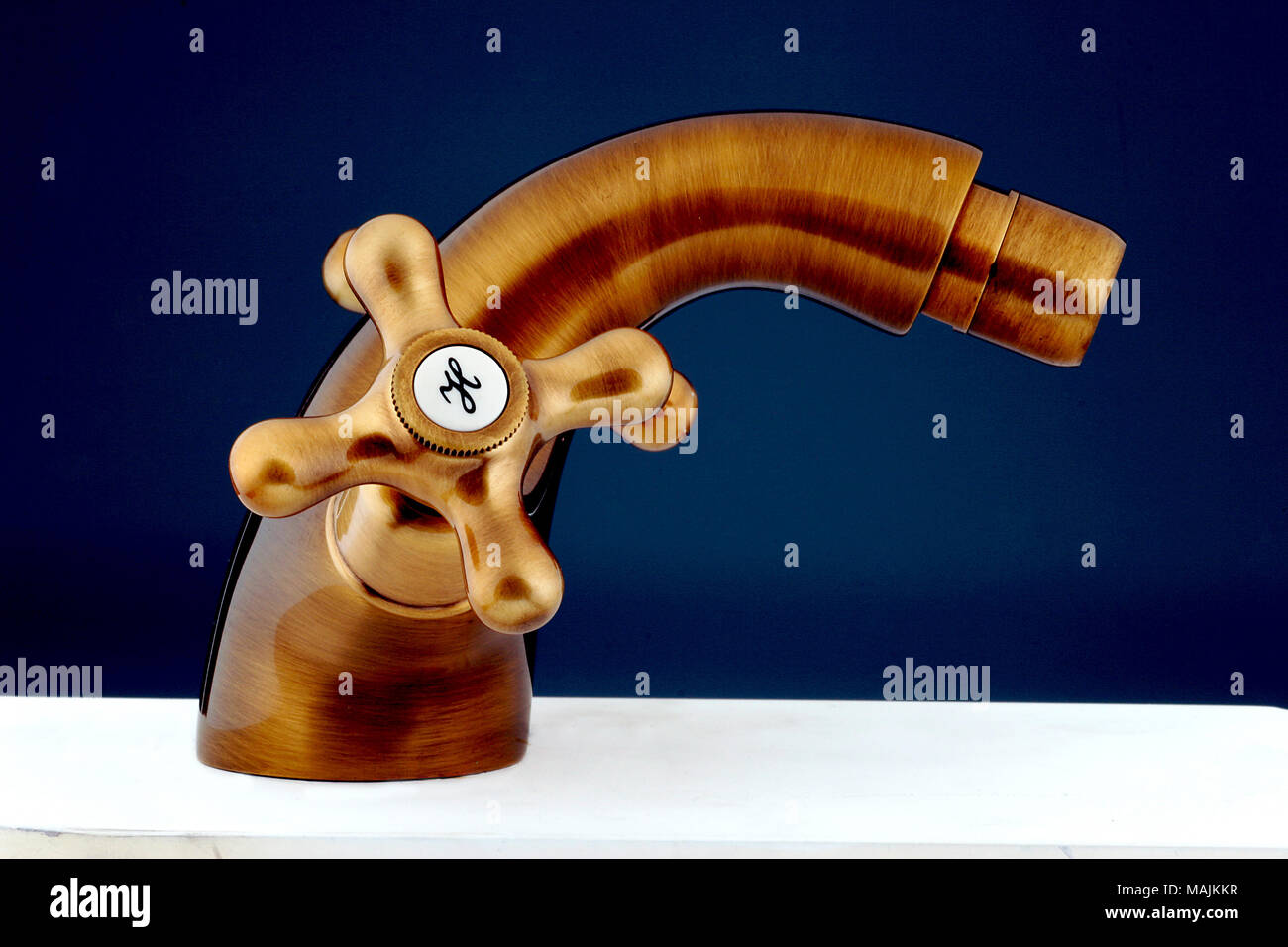 Bronzy metal tap of retro design. Faucet Stock Photo - Alamy