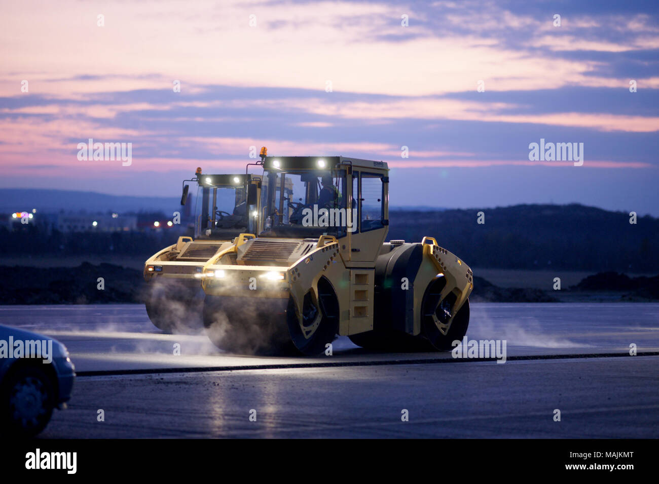 Road repair, vibration rollers at asphalt pavement works. Stock Photo