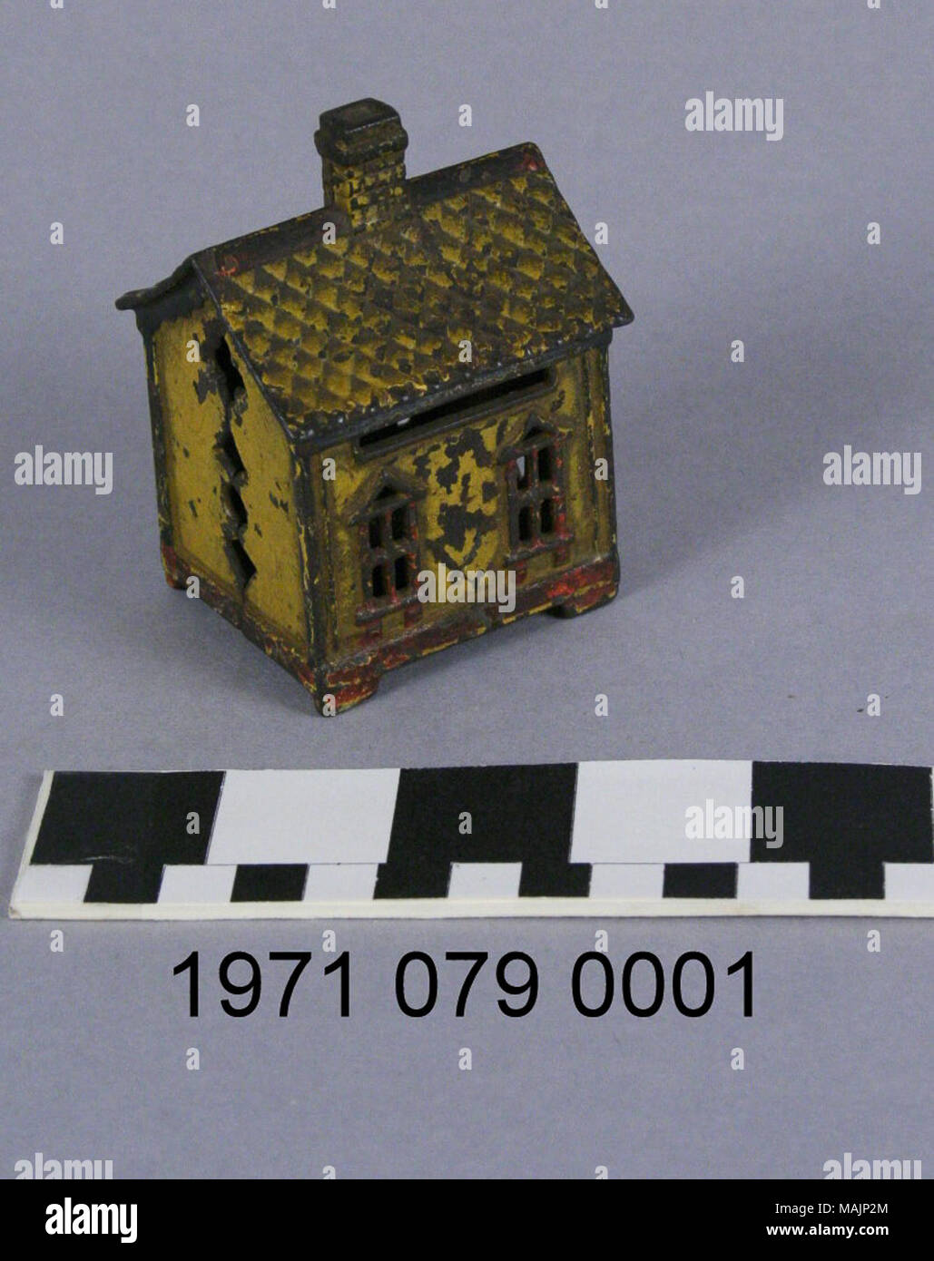 Cast Iron Bank In The Shape Of A House With A Chimney In The