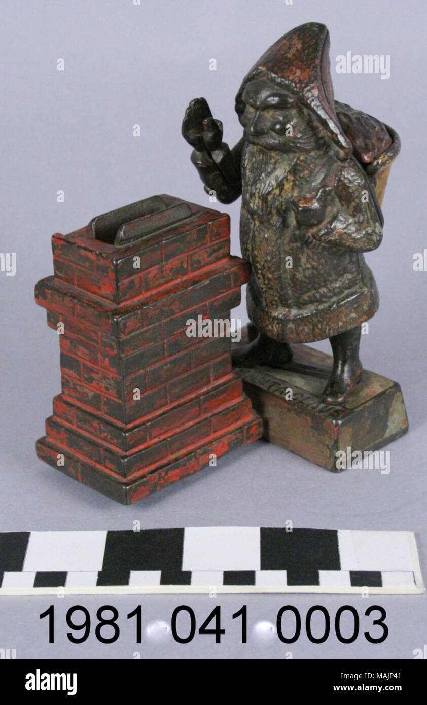 Cast iron bank in the shape of Santa Claus at a chimney. To operate the bank, a coin is placed in the figure's right hand. Pressing the lever near his right foot causes Santa's arm to lower depositing the coin into the opening in the chimney. Manufactured by the Shepard Hardware Company circa 1889. Title: Santa Claus Mechanical Coin Bank  . circa 1889. Peter Adams, Jr. (Designer), Charles G. Shepard (Designer), Shepard Hardware Company (Maker), Stock Photo