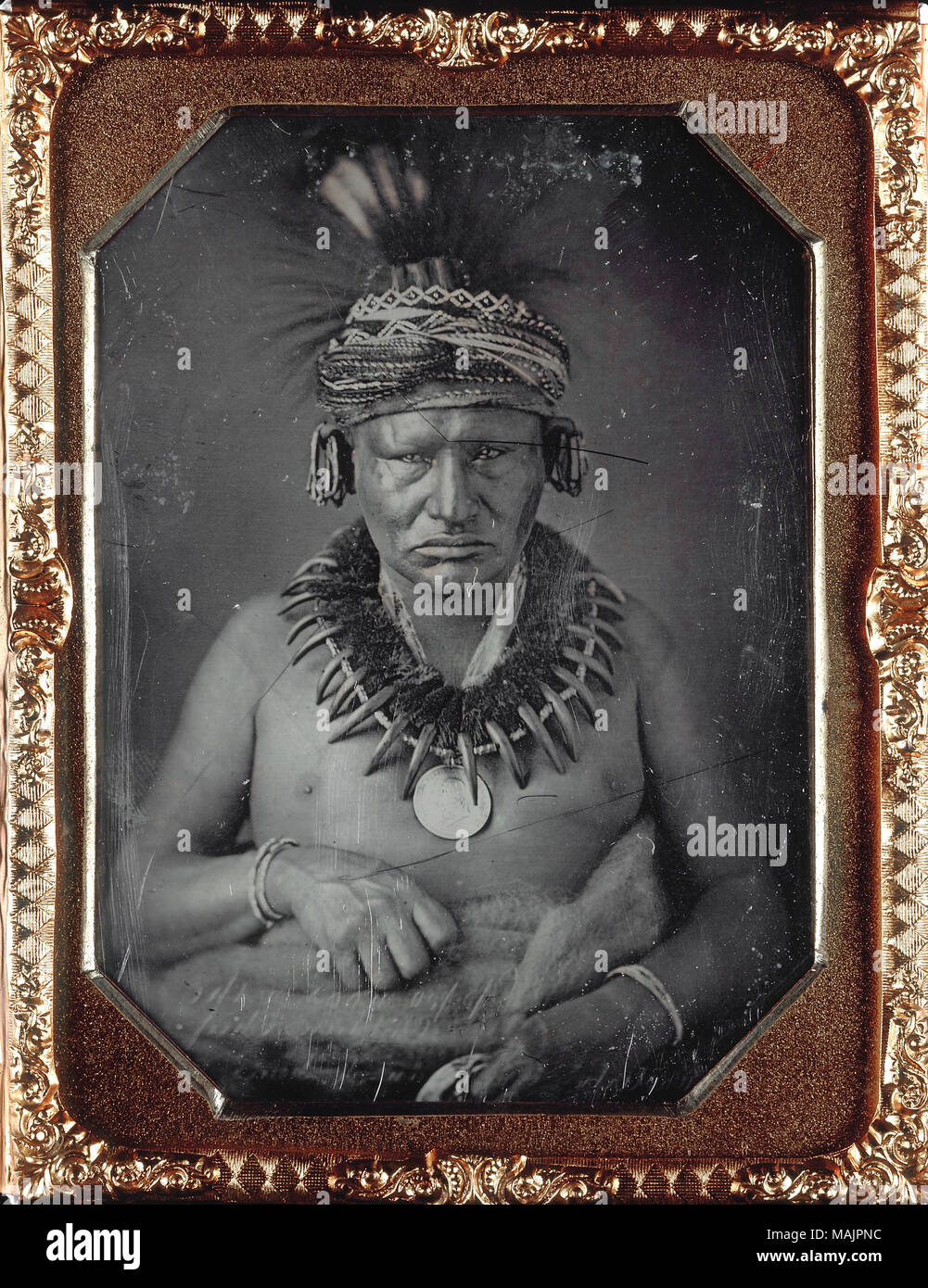 Portrait of Children's Chief, [Op-po-noos or Appanoose] Sac and Fox. Daguerreotype is in its original case. The words 'Easterly' and 'Artist' are engraved into the corners of the daguerreotype's frame. This daguerreotype has faint writing that is reversed, indicating that it is a duplicate plate. The writing is too faint to read. Title: Children's Chief, [Op-po-noos or Appanoose] Sac and Fox.  . 1847. Thomas M. Easterly Stock Photo