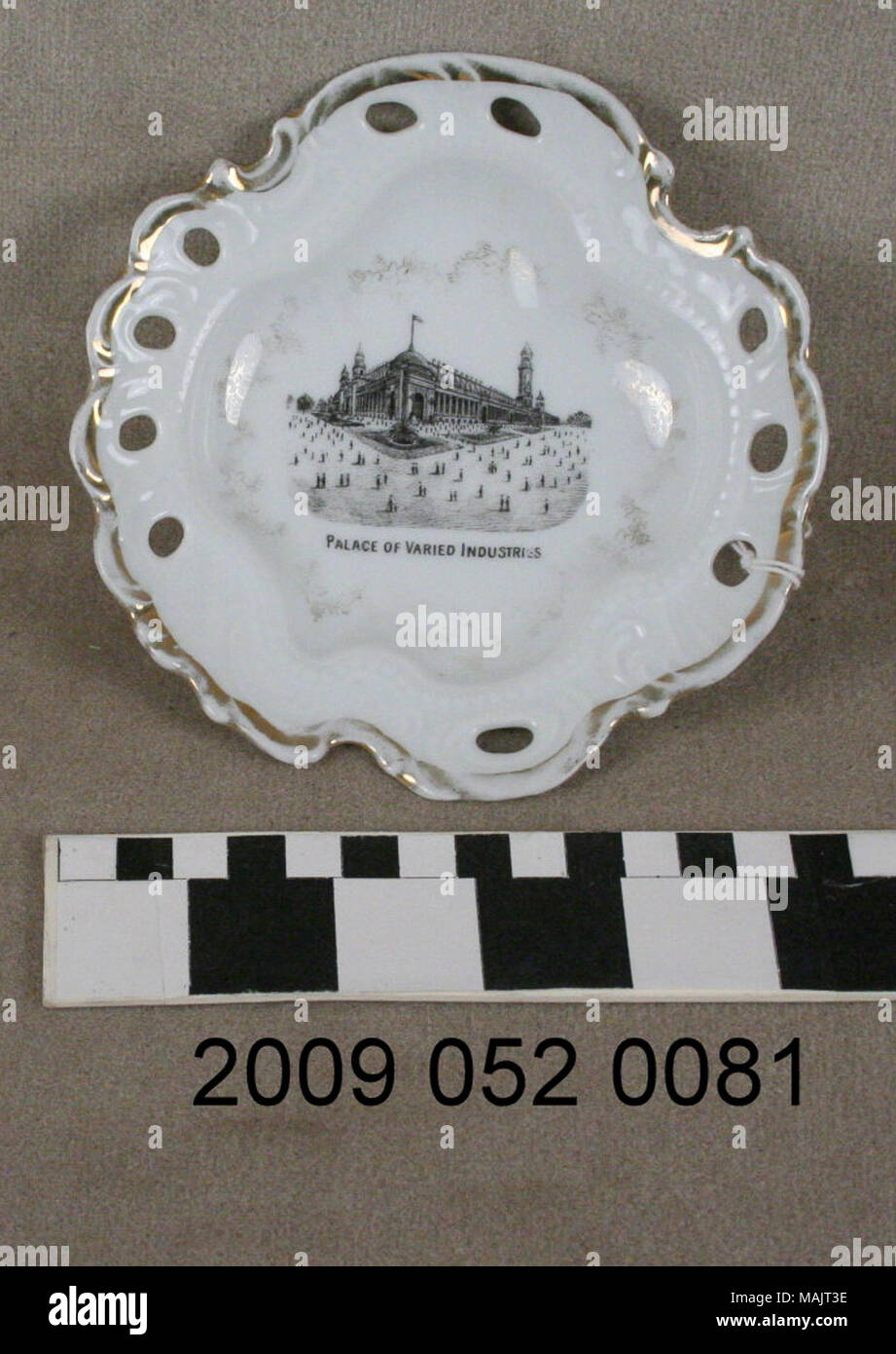 White ceramic candy dish with gilt d+?cor and black transfer image of