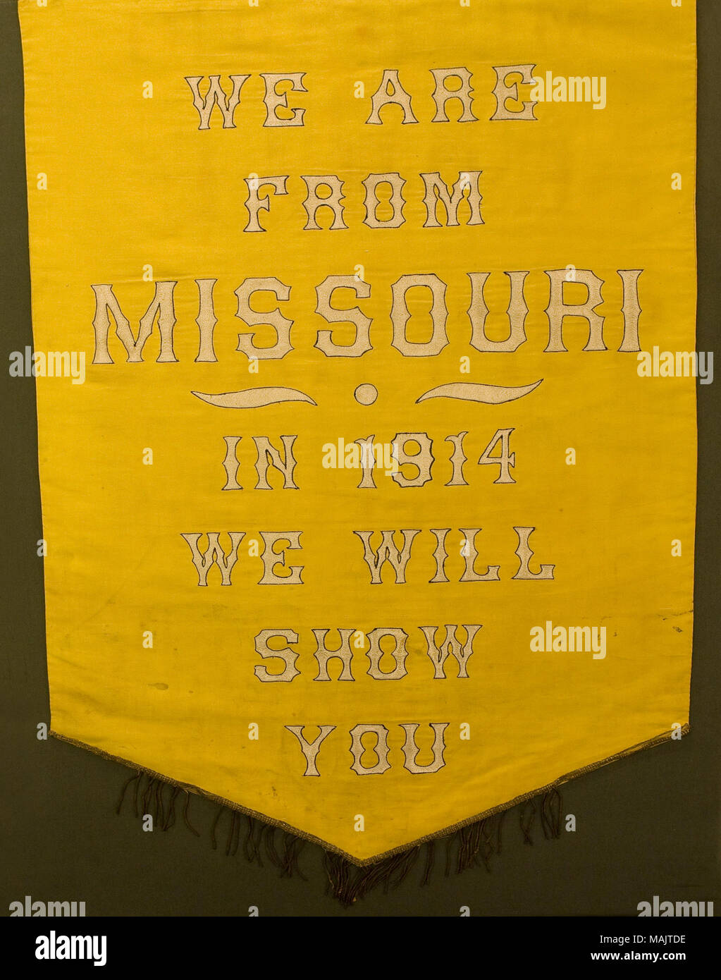 Yellow/gold colored sateen Missouri Equal Suffrage Association banner. Removed from wooden rod. Title: Missouri Equal Suffrage Banner  . circa 1914. Stock Photo