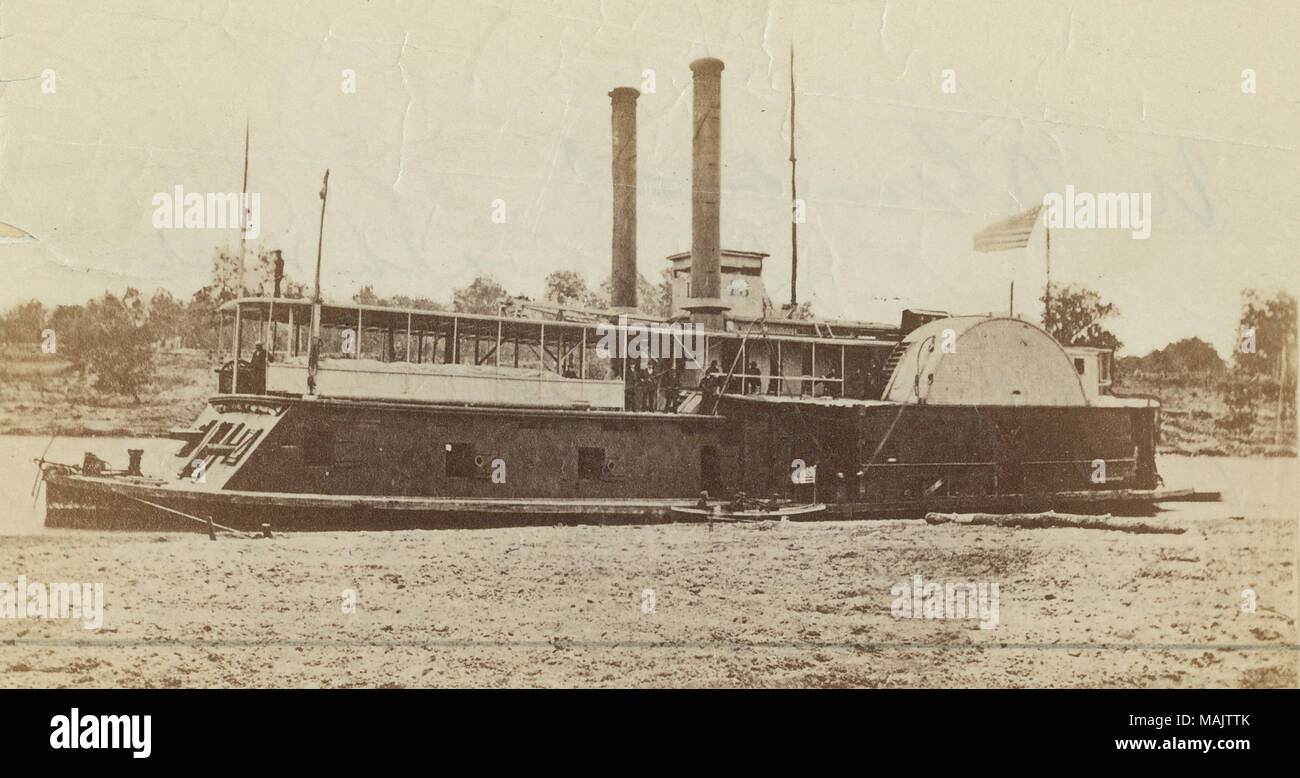 Photograph of an ironclad gunboat with twin stacks and several gun ports visible on port side and the stern. Union flag flying aft of the pilot house. 'Civil War: U. S. Gunboat 'Queen of the West' captured by the Confederates Feb. 4, 1863 and became C. S. Gunboat 'Queen of the West' and 'did' good service. Gift of John H. Gundlach' (written on reverse side). Title: U.S.S. Queen of the West.  . between 1861 and 1865. Stock Photo
