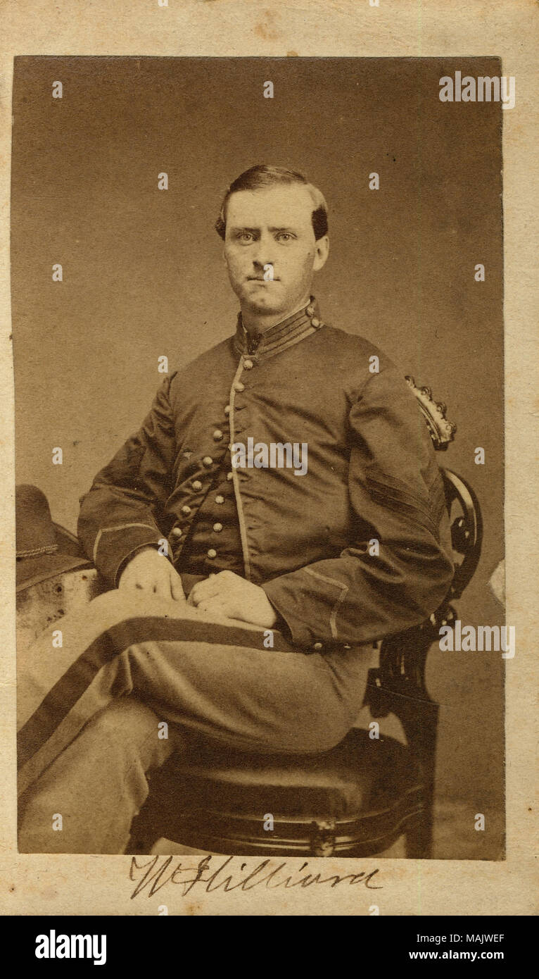 Full-length portrait of a seated man in uniform. 'W Hilliard' (written below image). There is a two cent stamp on reverse side of image. There is no way to tell which W. Hilliard this is. There are many listed in the digital online records. Title: W. Hilliard.  . between 1861 and 1865. L.B. Silver, Salem, OH Stock Photo