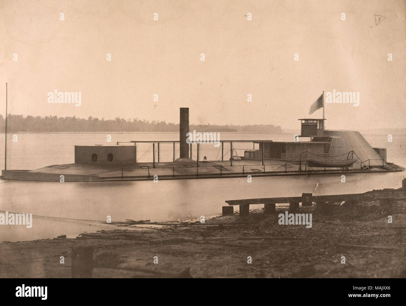 Photograph of the Gunboat Osage just off shore with hand-drawn highlights. Text supplied with image reads: 'U.S. Iron hull and iron clad Gunboat Osage. Launched, January 13th 1863. Length =180 feet. Width = 45 feet. Draught = 3 feet 9 inches. 2 non condensing engines. 20 inch cylinders - 6 feet stroke. Wheel: 19 feet diameter. Designed and constructed by Jas. B. Eads. St. Louis, Mo.' Title: 'U.S. Iron hull and iron clad Gunboat Osage.'  . circa 1863. Stock Photo
