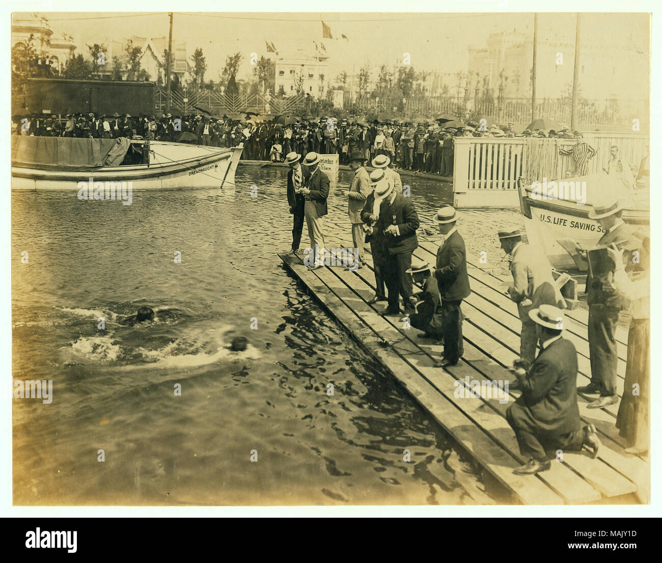 Horizontal photograph of the finish of the 220 yard swimming competition in the 1904 Olympic Games. 'Daniels, New York Athletic Club, winning'. Title: 1904 Olympics: Finish of 220 yard swim competition.  . 1904. Stock Photo