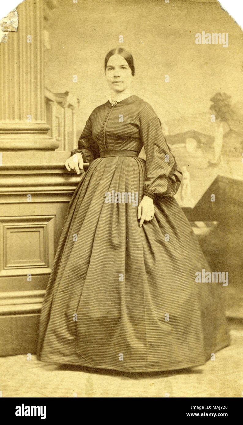 Mrs. Andrew S. Barada, 1828-1917, born Eliza Philbert, 1828-1917,  full-length portrait, she's in plain dark colored dress with hair pulled  back in a severe style. Picture taken on August 5, 1855. Married