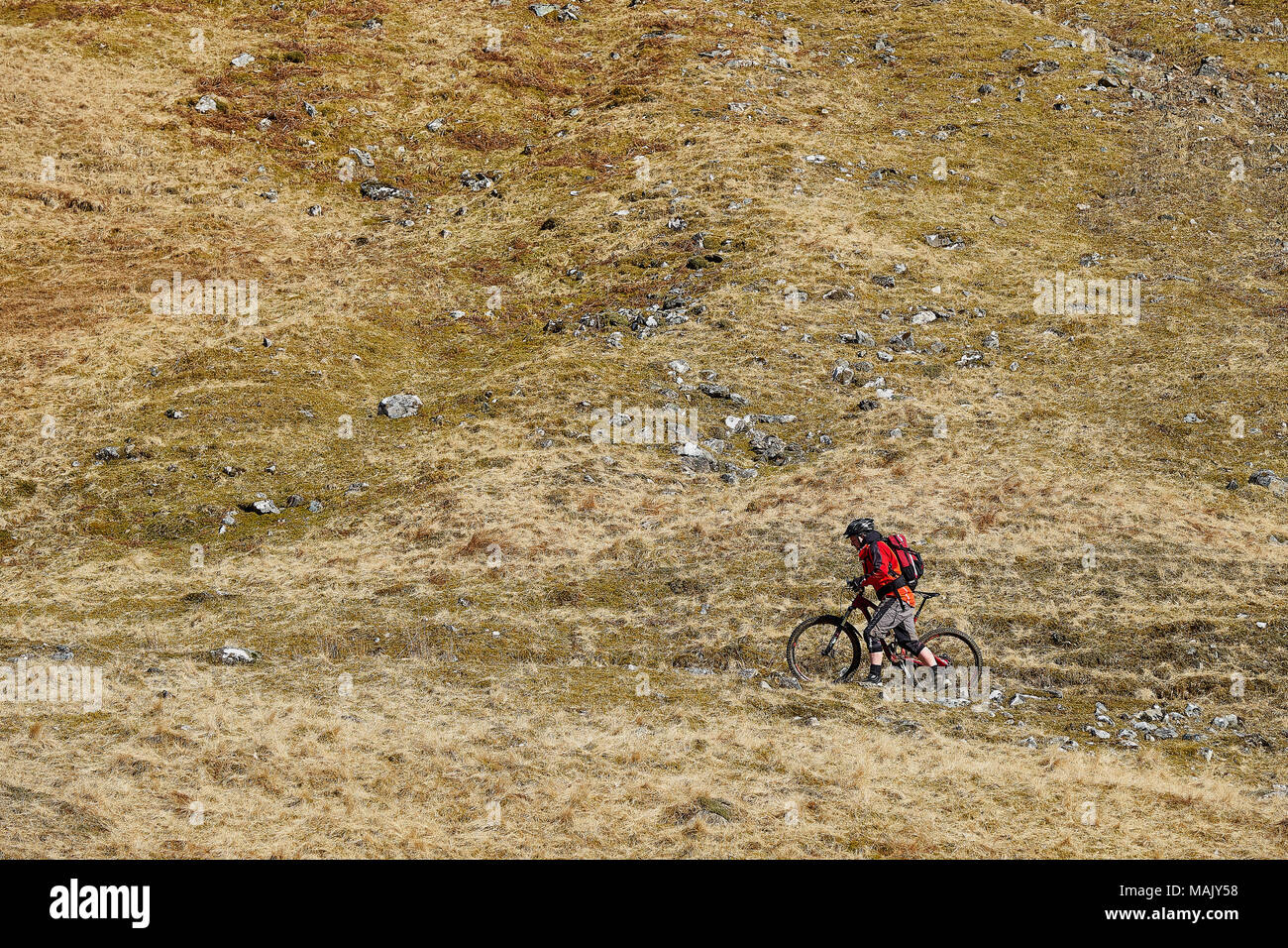 Cycling on mountain track Stock Photo