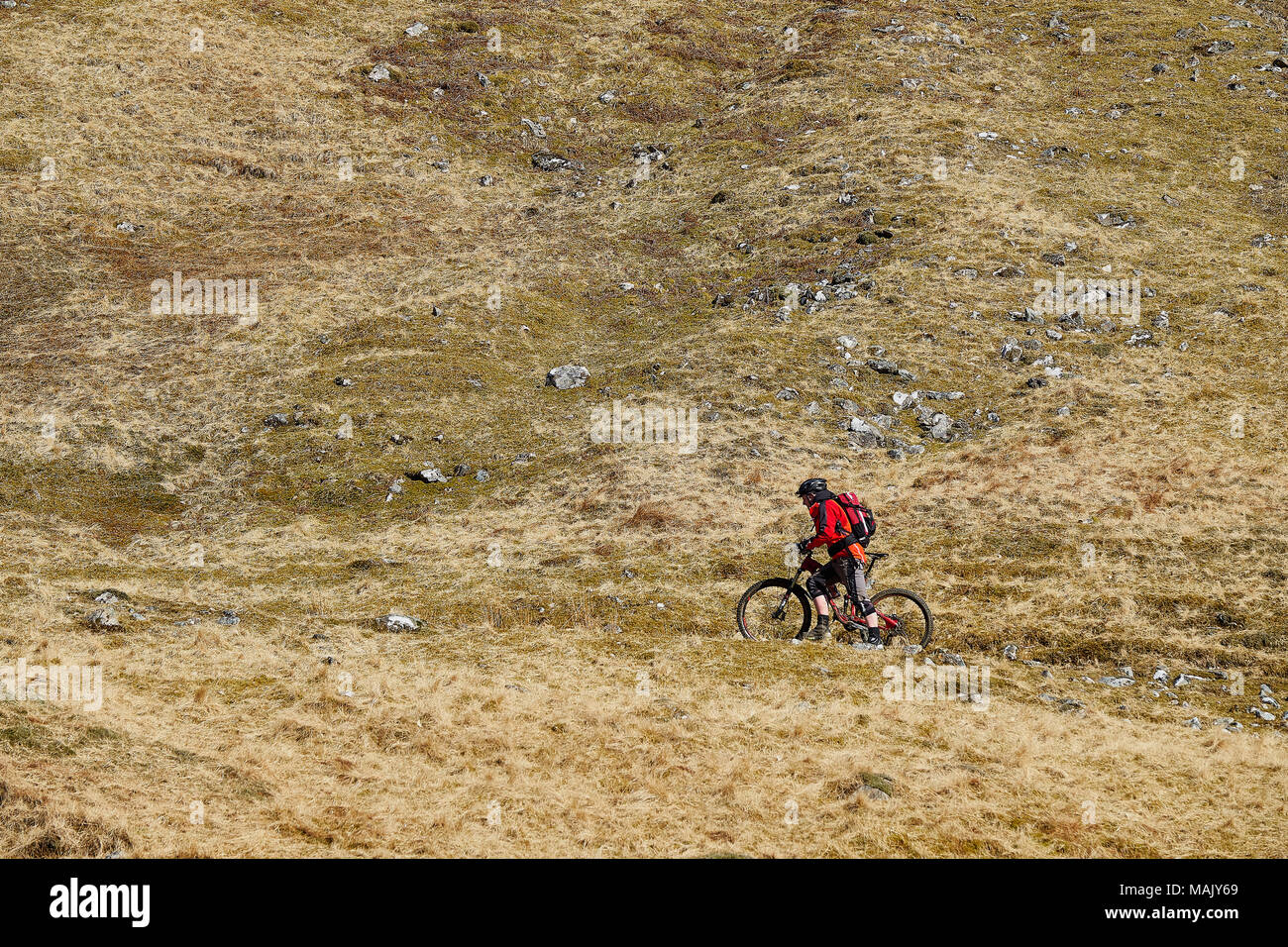 Cycling on mountain track Stock Photo