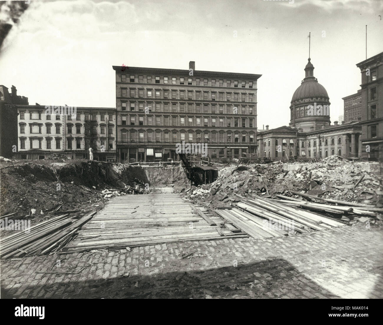 Excavation for the International Fur Exchange building on the southeast corner of Fourth and Market Streets. The Old Court House is visible at right. St. Louis was a major fur trading center during the 19th and 20th centuries. The International Fur Exchange Building is the only building still standing from St. Louis' fur trading heyday. Around the time this building was constructed, 60-70 Excavation for the International Fur Exchange building on the southeast corner of Fourth and Market Streets.  . 1919. F.M. White Stock Photo