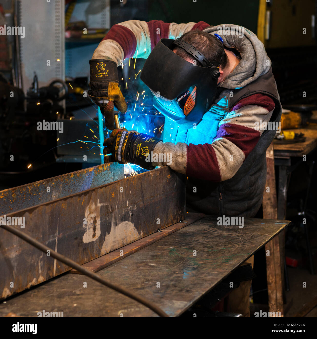 Welder arc welding steel frame Stock Photo Alamy