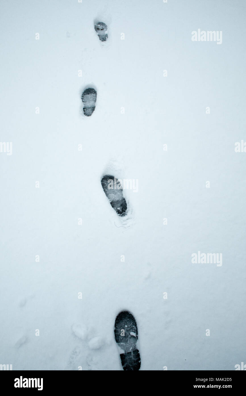 Footprints in the snow Stock Photo