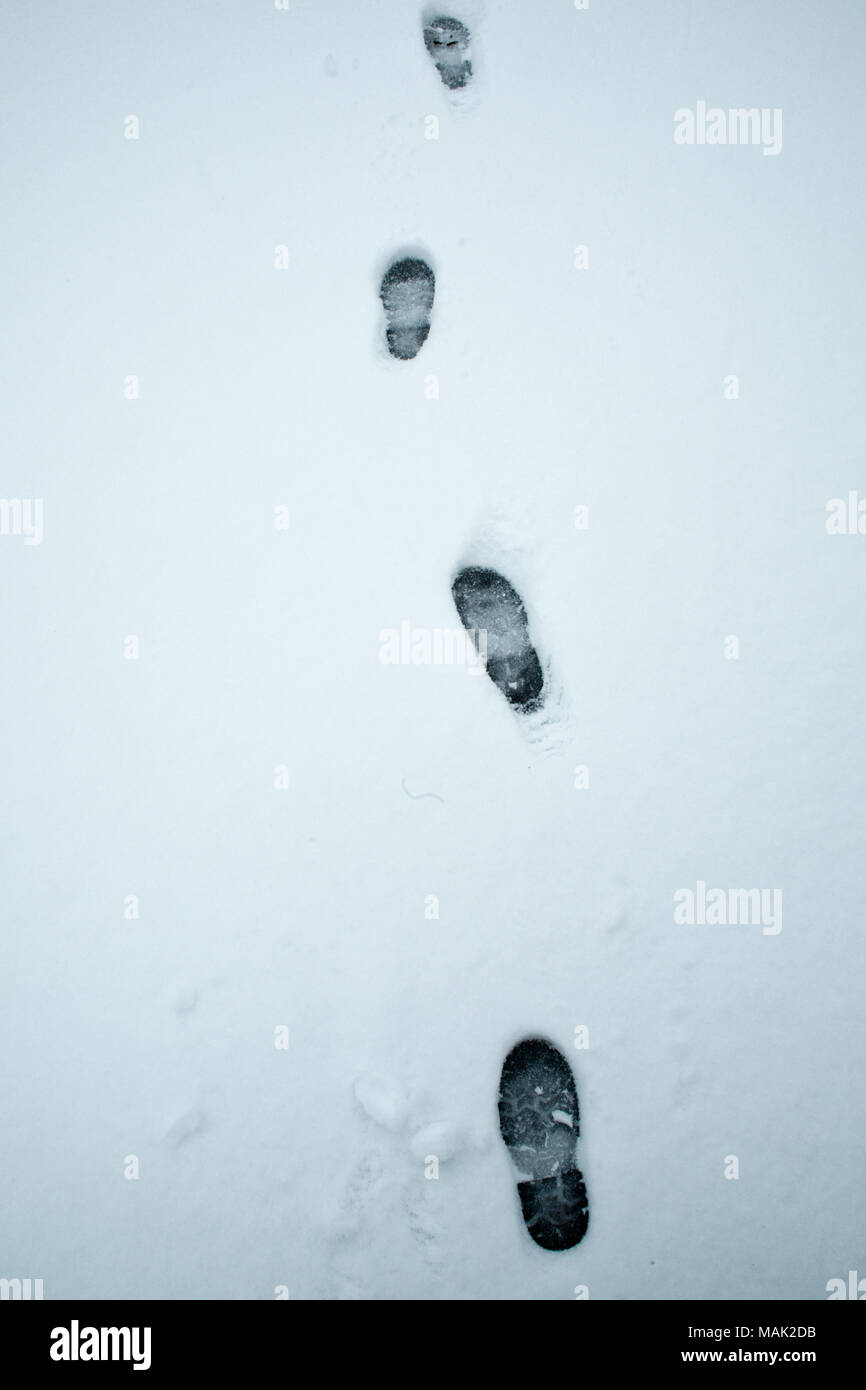 Footprints in the snow Stock Photo