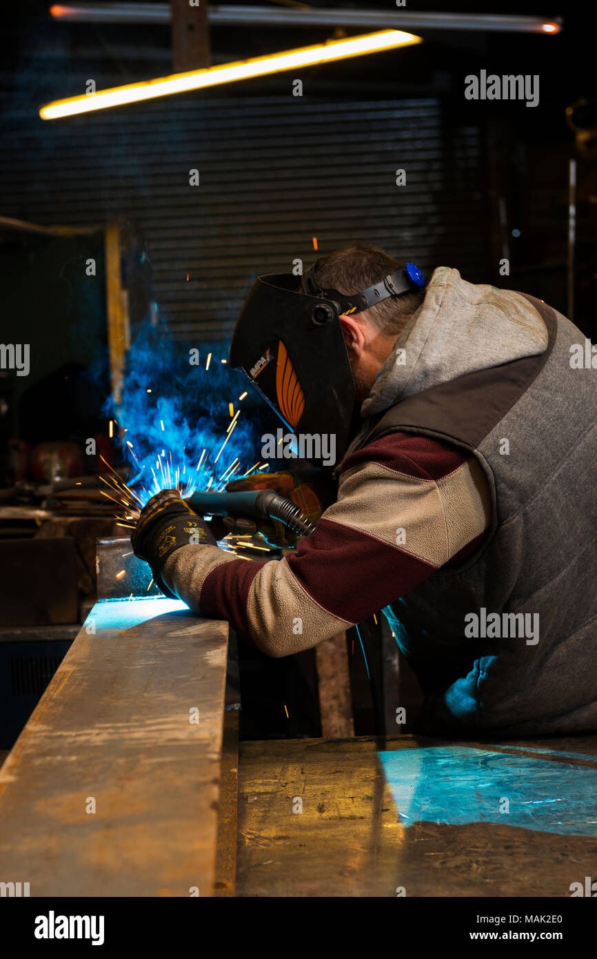 Welder arc welding steel frame Stock Photo Alamy