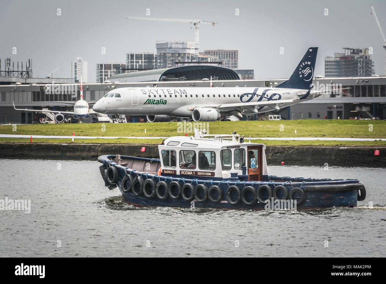 An Alitalia Skyteam Embraer 190 jet on the tarmac at London City Airport, in the London Borough of Newham, London, UK Stock Photo