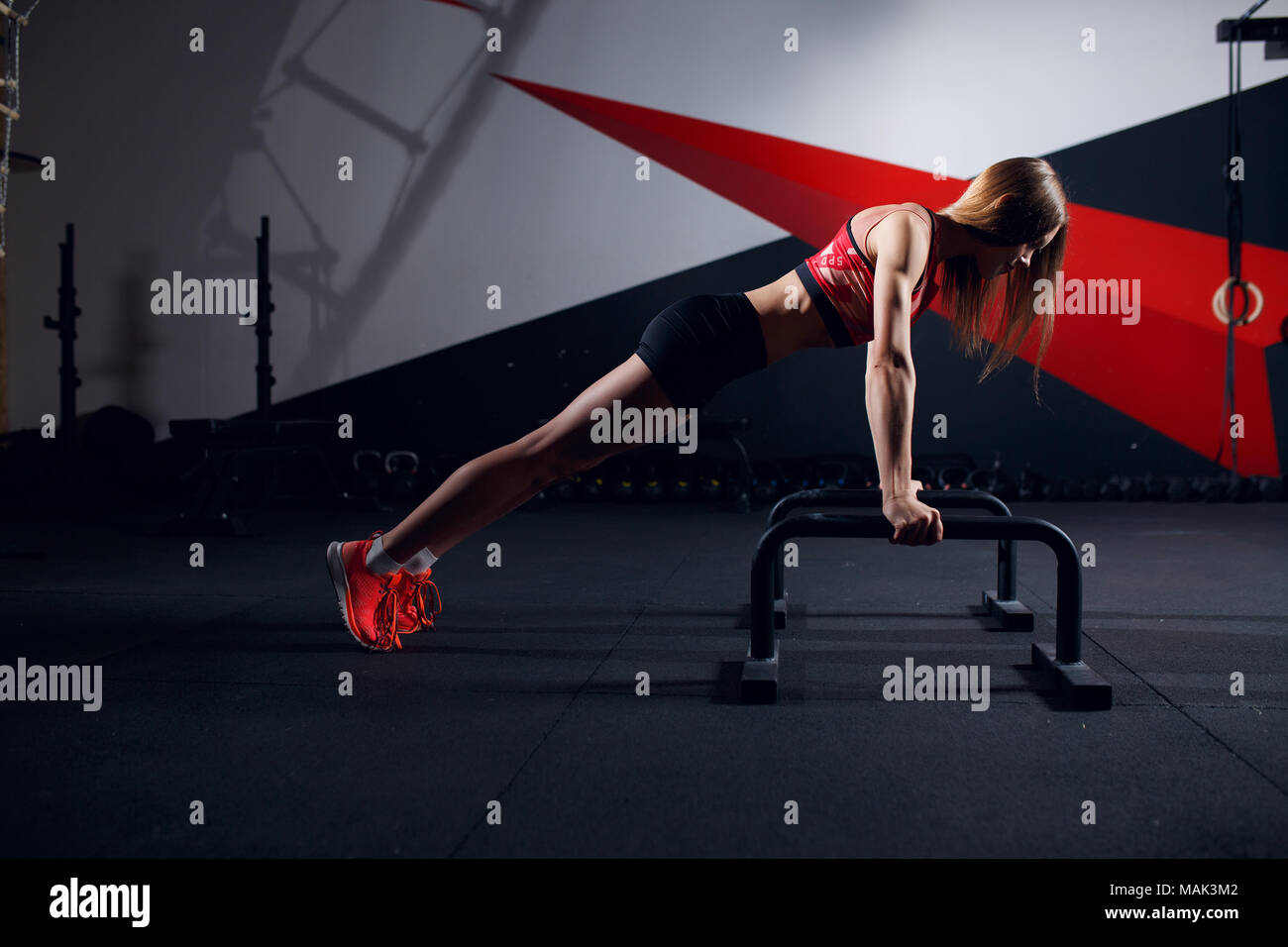 Photo of sports woman doing exercise bar Stock Photo