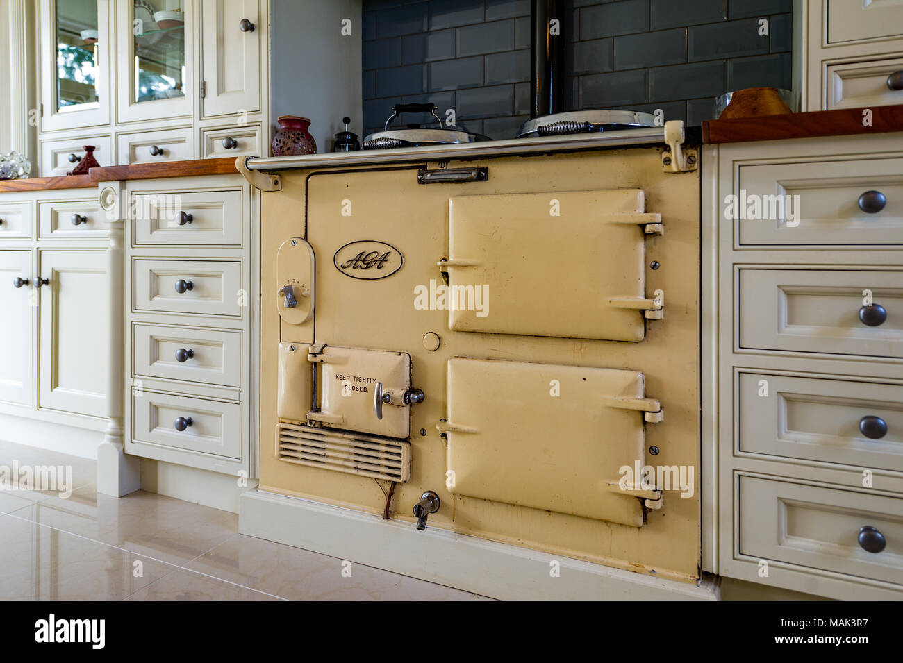 Traditional AGA range cooker in a domestic kitchen. Stock Photo