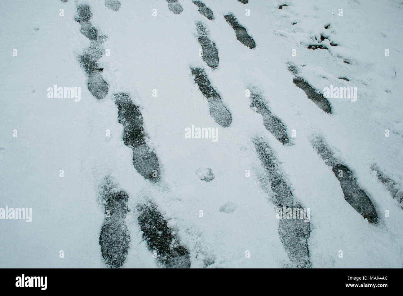 Footprints in the snow Stock Photo