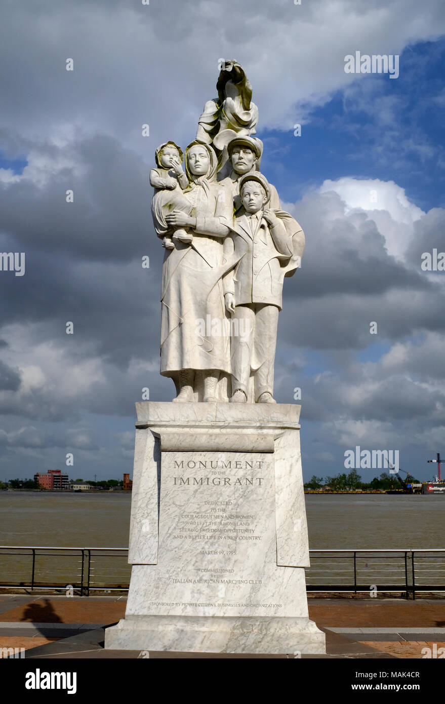 Monument to the Immigrant in New Orleans, Louisiana with dark clouds looming behind Stock Photo
