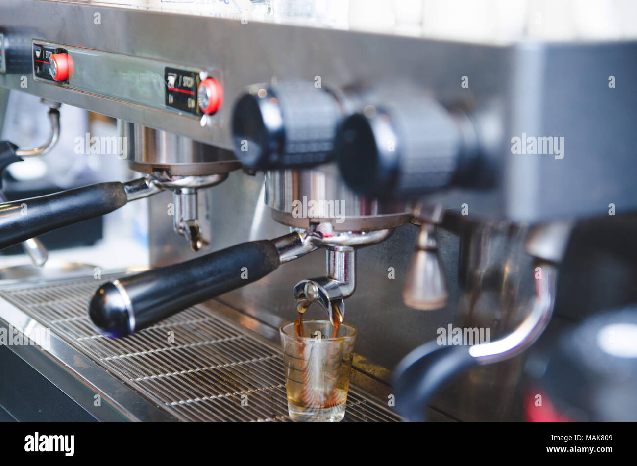 https://c8.alamy.com/comp/MAK809/prepares-espresso-in-his-coffee-shop-close-up-vintage-tone-MAK809.jpg