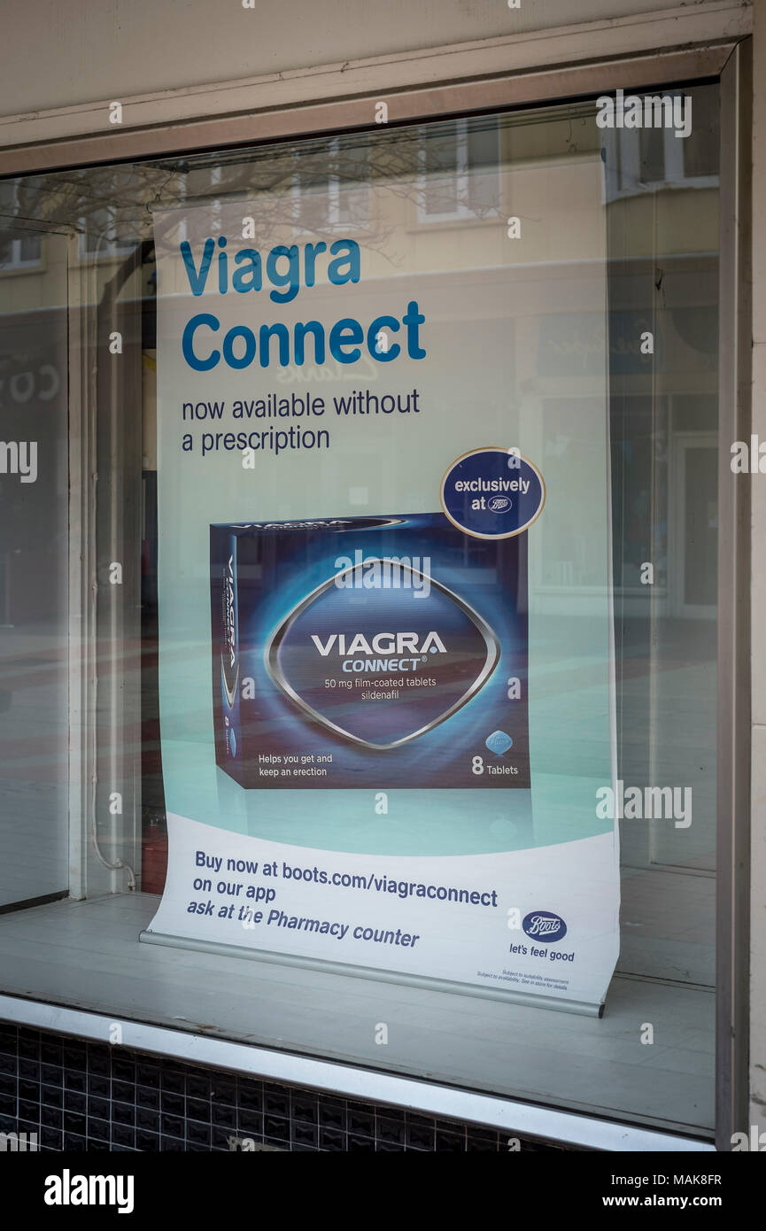 Boots the chemist shop window advertising Viagra available without  perscription Stock Photo - Alamy