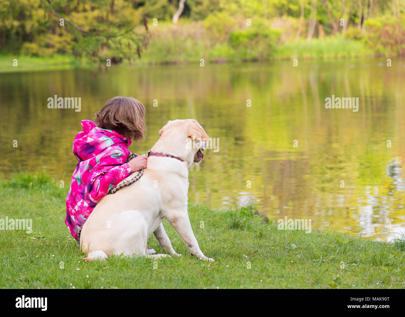 Girl with dog in park Stock Photo