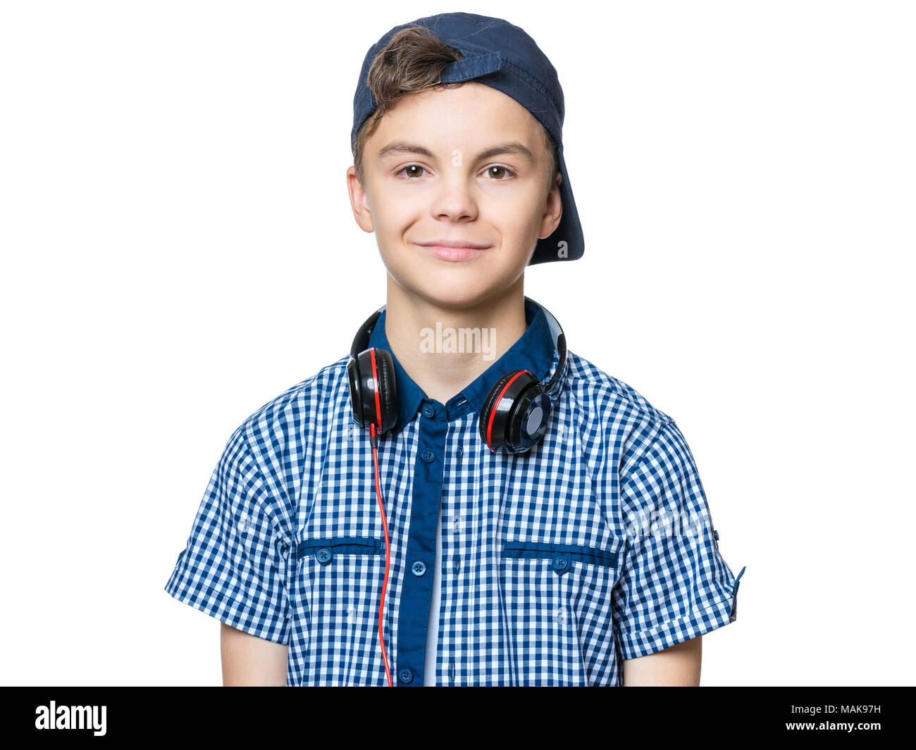 Teen boy with cap and headphones Stock Photo