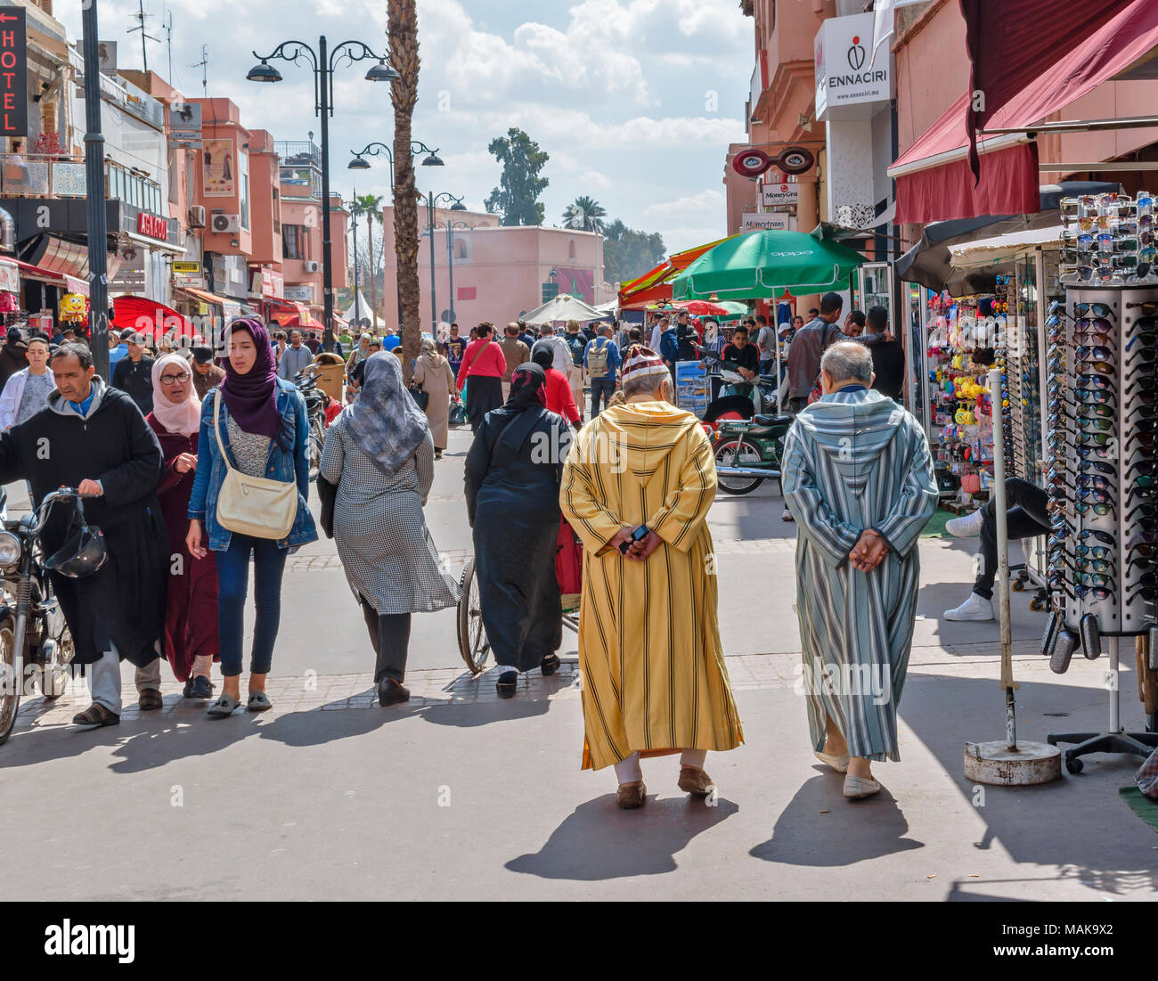 MOROCCO MARRAKECH STREET SCENE WITH PEOPLE DRESSED IN TRADITIONAL CLOTHES THE DJELLABA Stock Photo