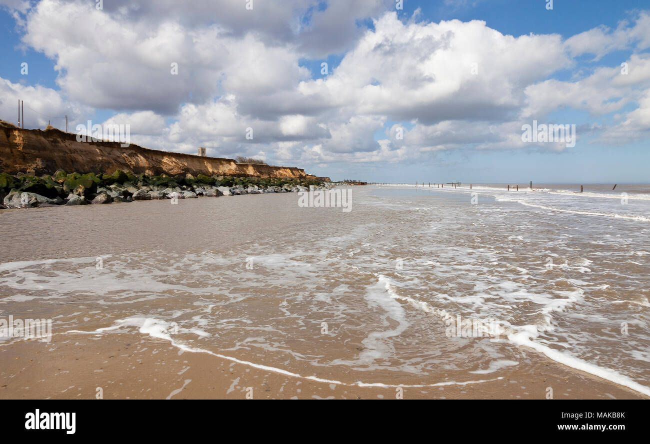 Rock sea defences at low tide at Happisburgh Beach in Norfolk England ...