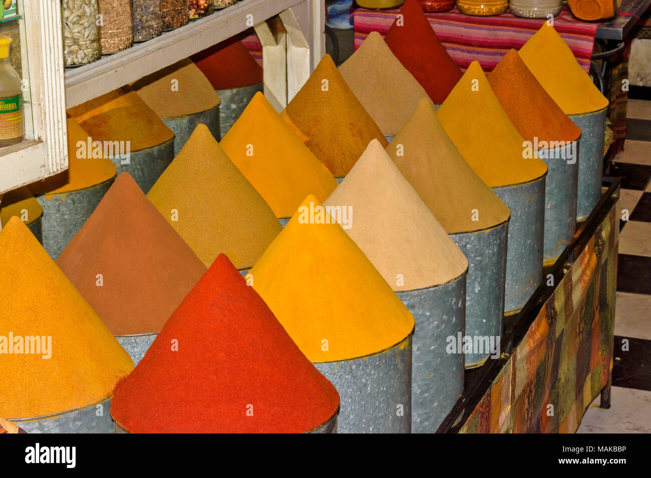 MOROCCO MARRAKECH JEMAA EL FNA MEDINA SOUK COLOURED CONES OF SPICES WITHIN METAL CONTAINERS Stock Photo