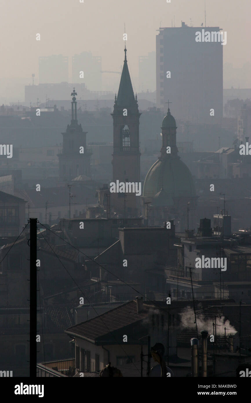Terrible air pollution or smog from traffic fumes visible on the Milan skyline. The air quality was noticeably poor that day. Milan, Italy. Stock Photo