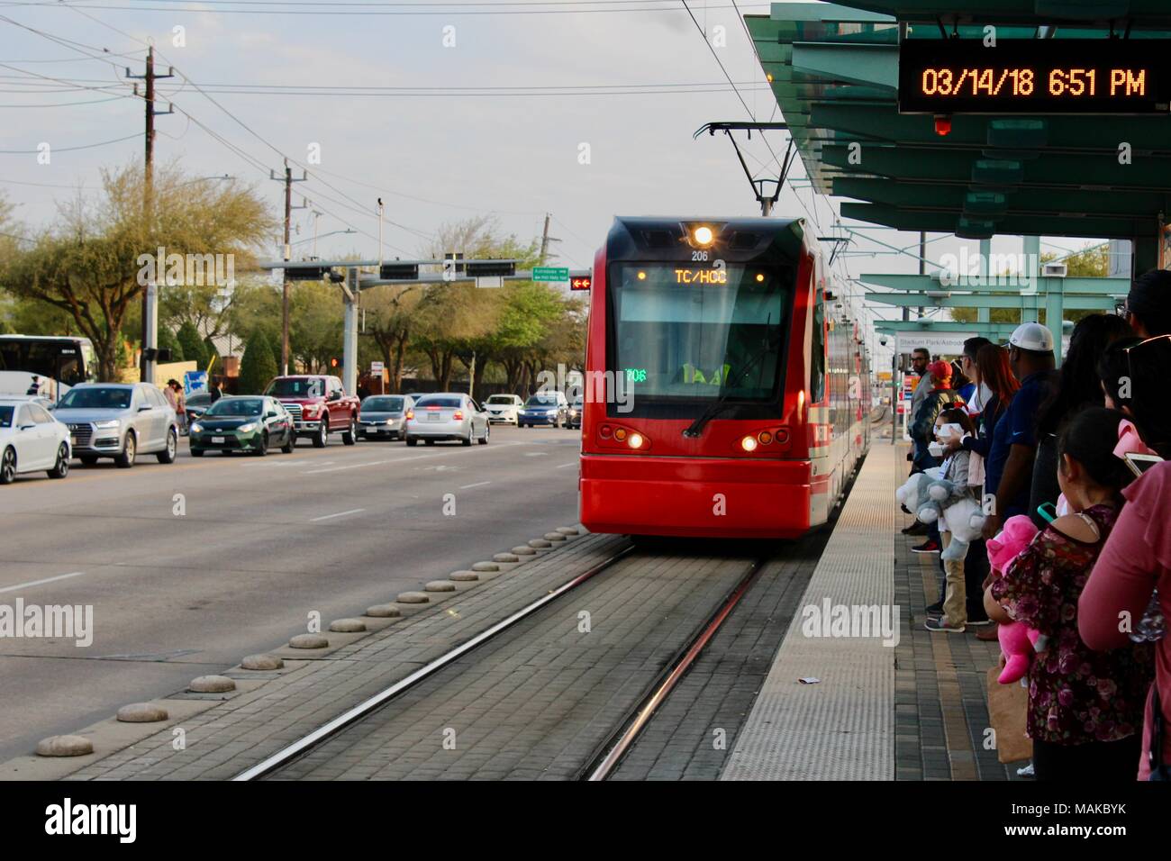 passengers wait for the arriving METRORail tram texas USA Stock Photo