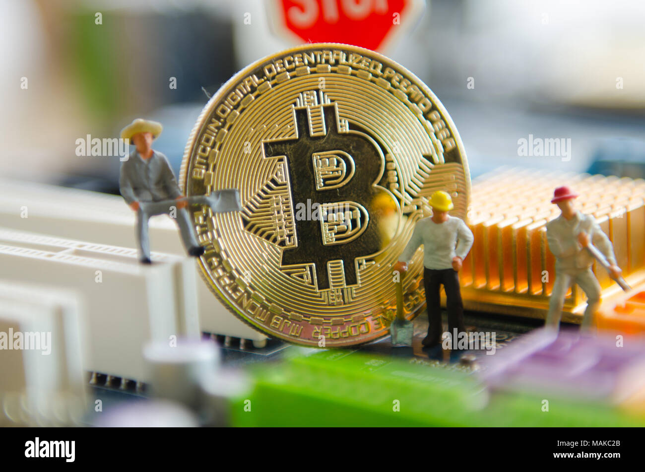 Marco shot of bitcoin and minner worker man , figures working on group of  bitcoins. virtual cryptocurrency mining concept Stock Photo - Alamy