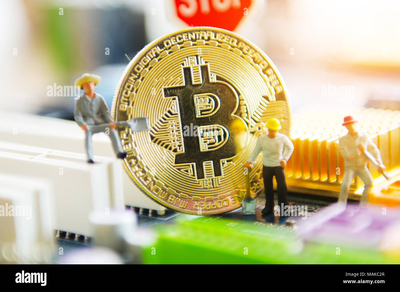 Marco shot of bitcoin and minner worker man , figures working on group of  bitcoins. virtual cryptocurrency mining concept Stock Photo - Alamy