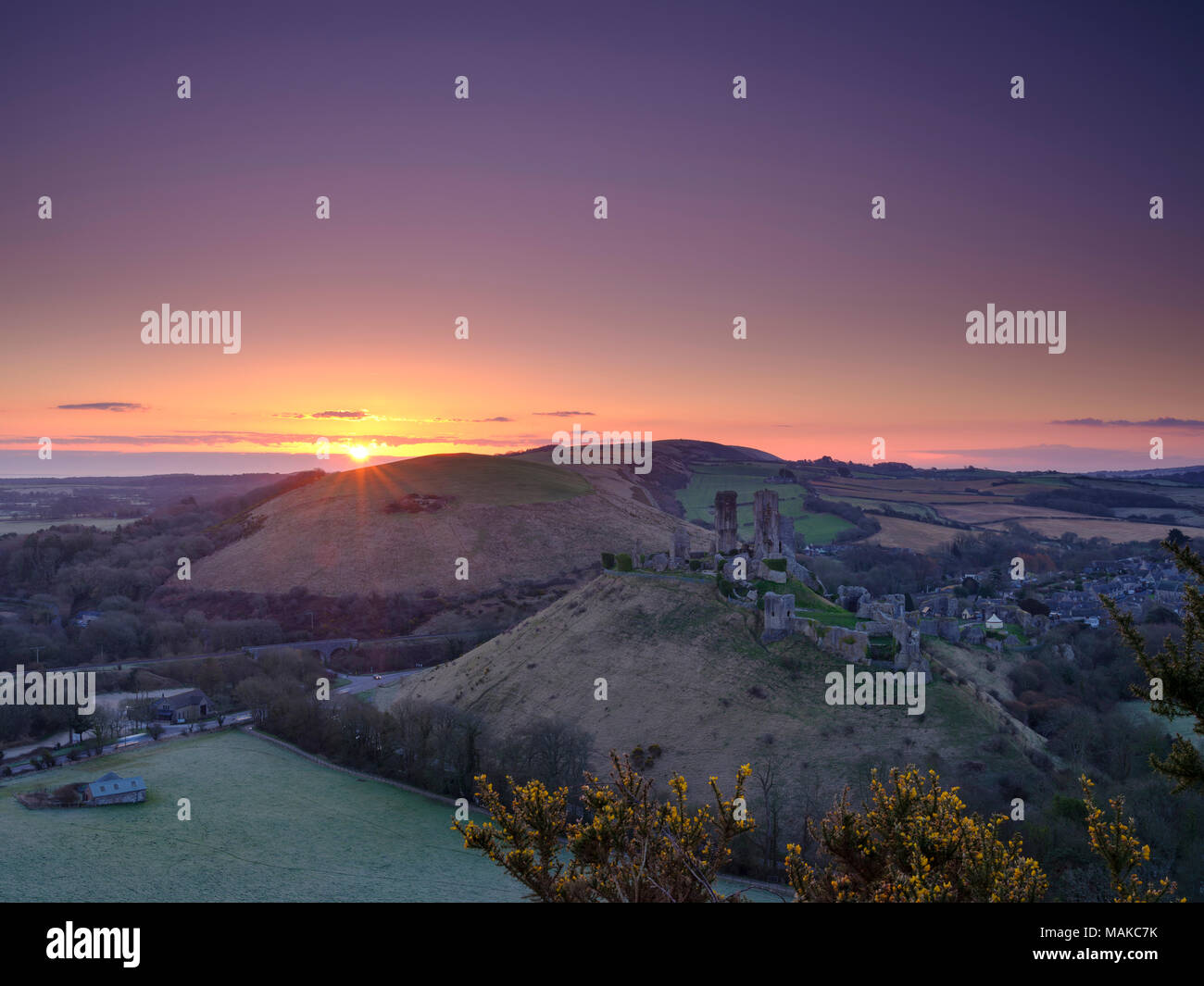 Spring sunrise over Corfe Castle, Purbeck, Dorset, UK Stock Photo