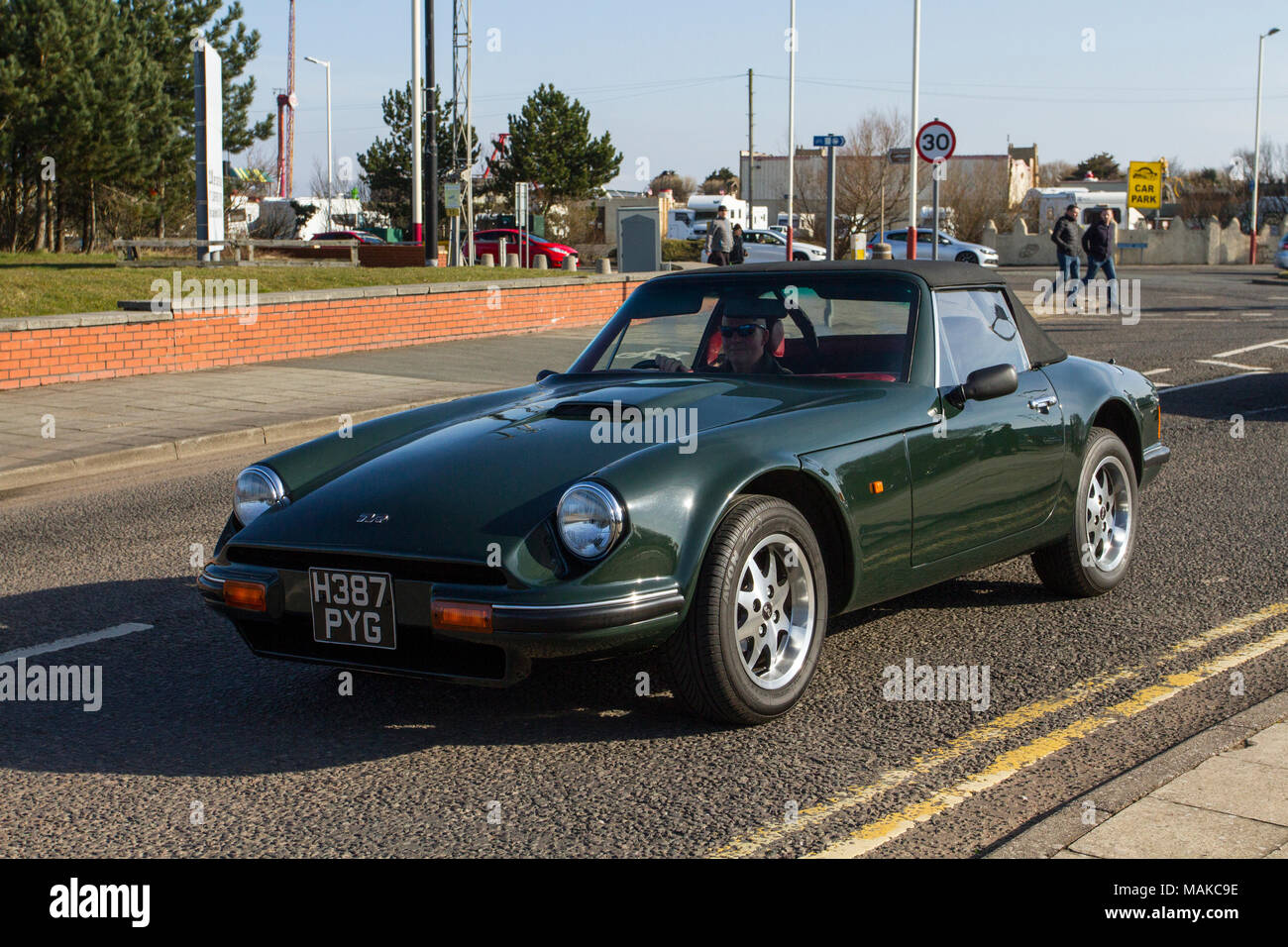 Green 1990 Tvr 290 S3 at the North-West Supercar event as cars and tourists arrive in the coastal resort. Cars are bumper to bumper on the seafront esplanade as classic & vintage car enthusiasts take advantage of warm weather for a motoring day out. Stock Photo