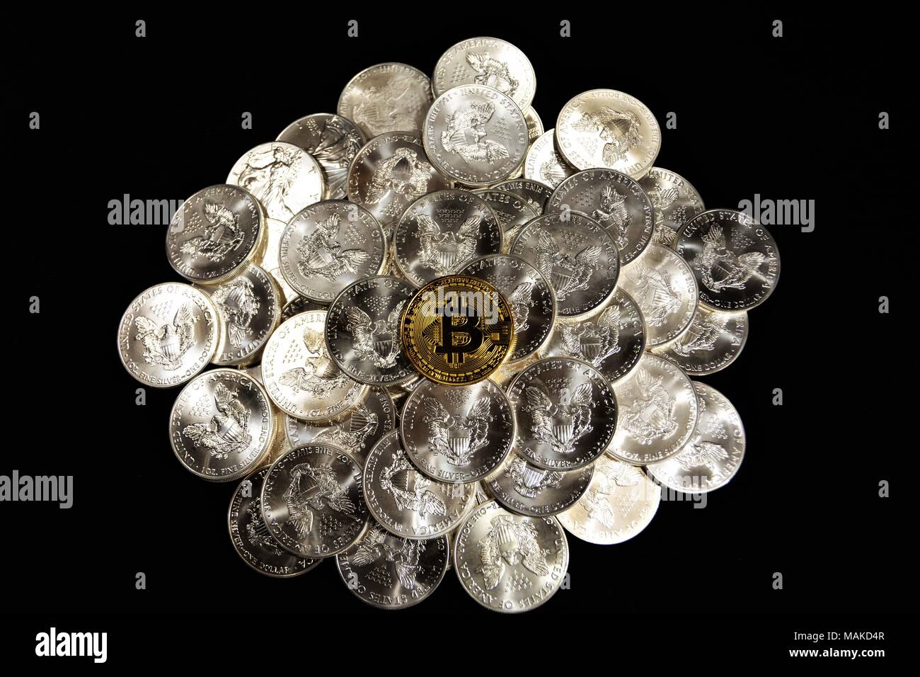 Bit coins with silver dollars and diamonds. Stock Photo