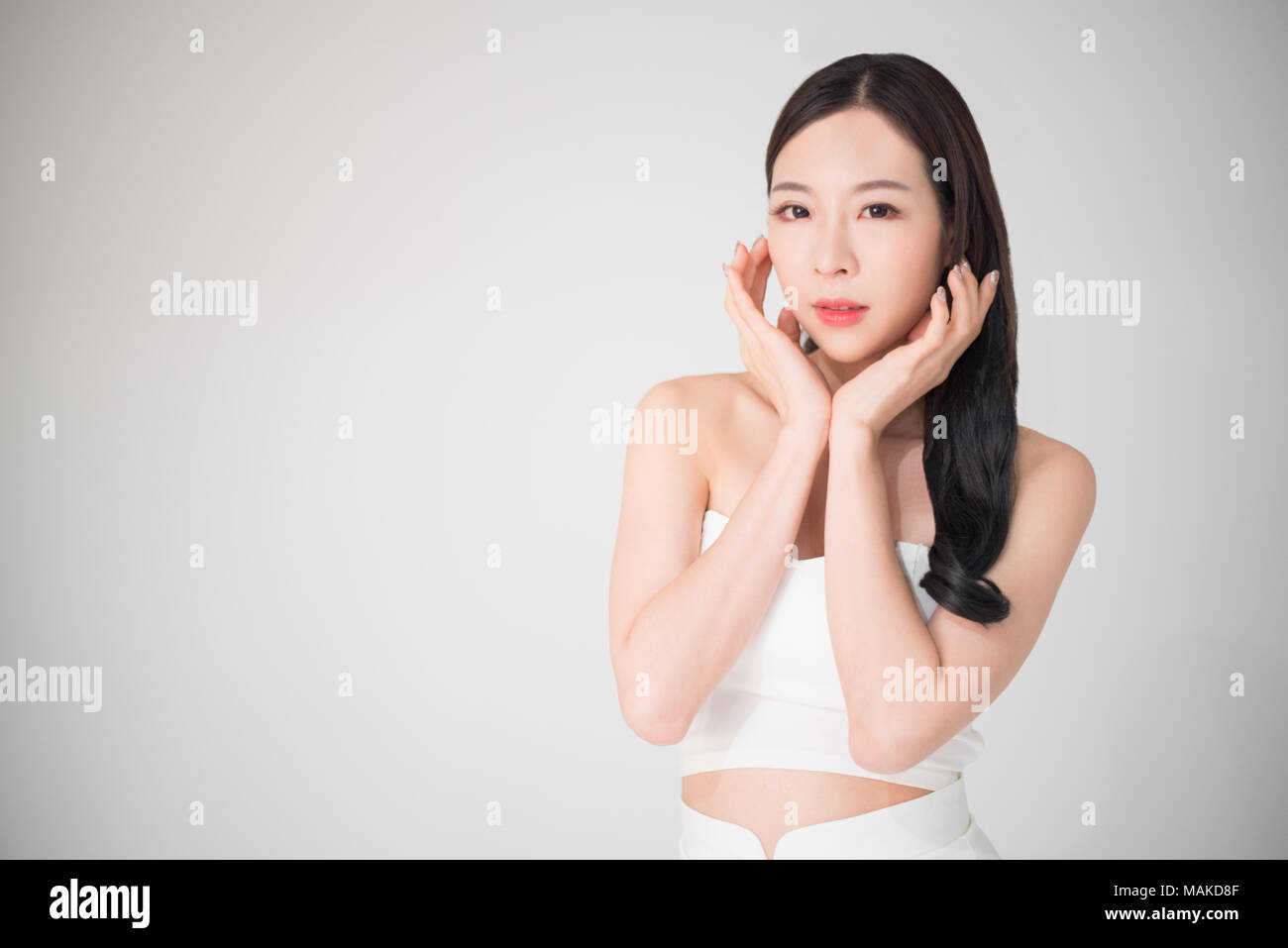 Beautiful asian woman with skin care or facial care concept isolated on white background, beauty treatment surgery concept. Facial care and skin care  Stock Photo