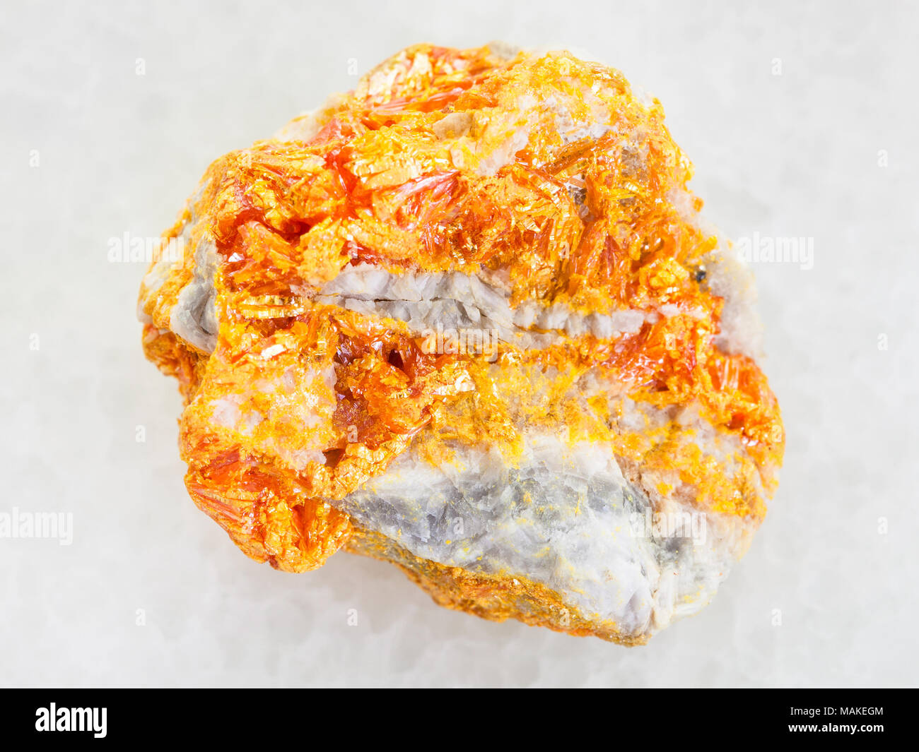 Macro Shooting Of Natural Mineral Rock Specimen Raw Yellow Orpiment Crystals On White Dolomite Stone On White Marble Background From Kabardino Balka Stock Photo Alamy