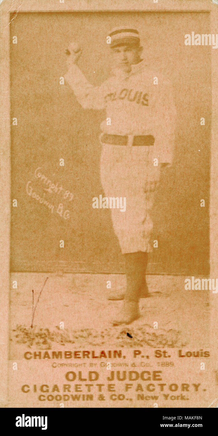 Vertical, pink photograph of Chamberlain. on a baseball card. He is wearing a white uniform with sneakers and a cap. His jersey reads 'St. Louis.' He is holding a ball up to eye level as if he's going to throw it. Below the photo it reads 'P Chamberlain., Chicago. Goodwin & Co. New York.' Title: Old Judge Goodwin and Company baseball card for St. Louis Brown's Chamberlain.  . 1889. Goodwin and Co. Stock Photo