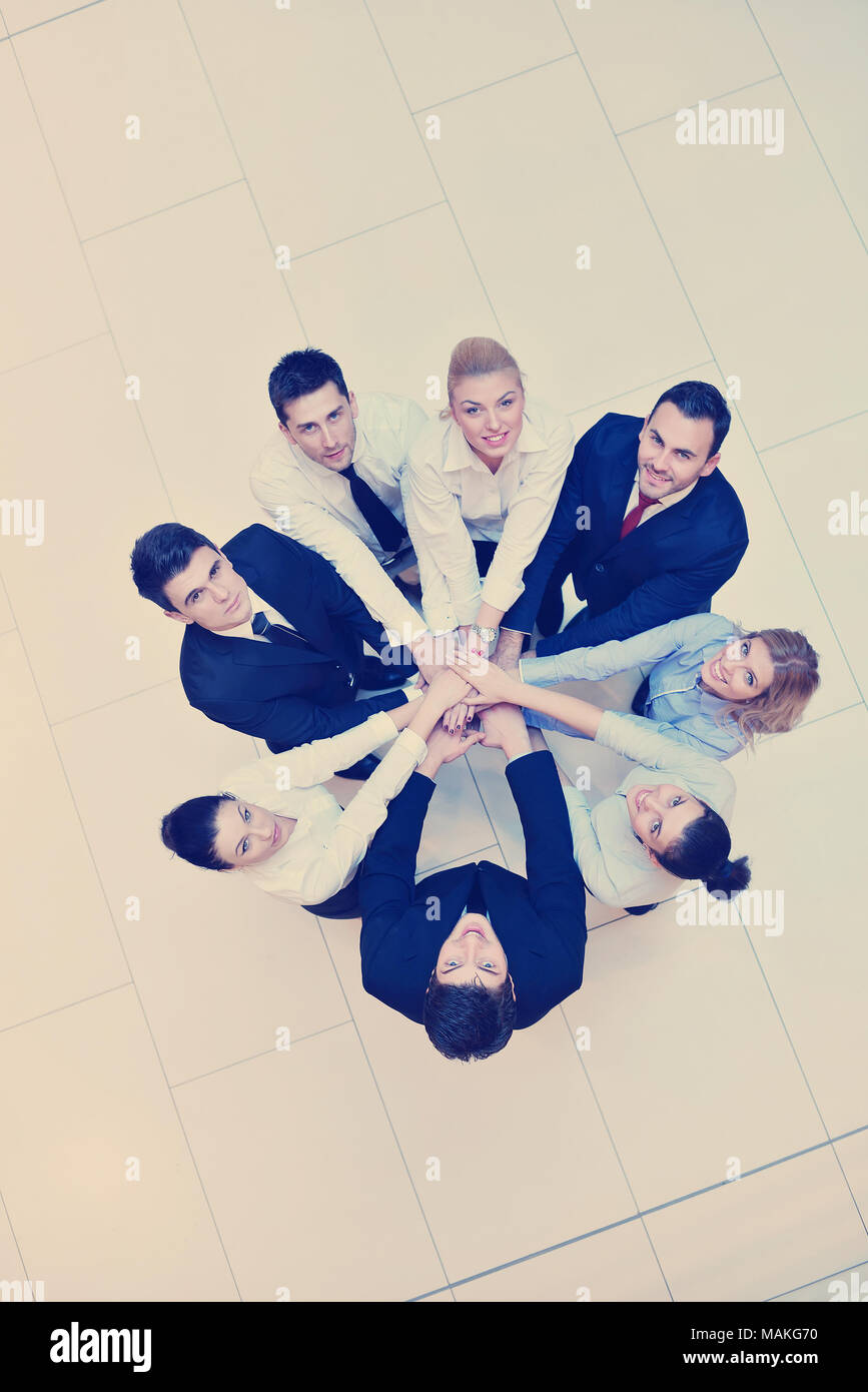 business people group joining hands and stay as team in circle and ...