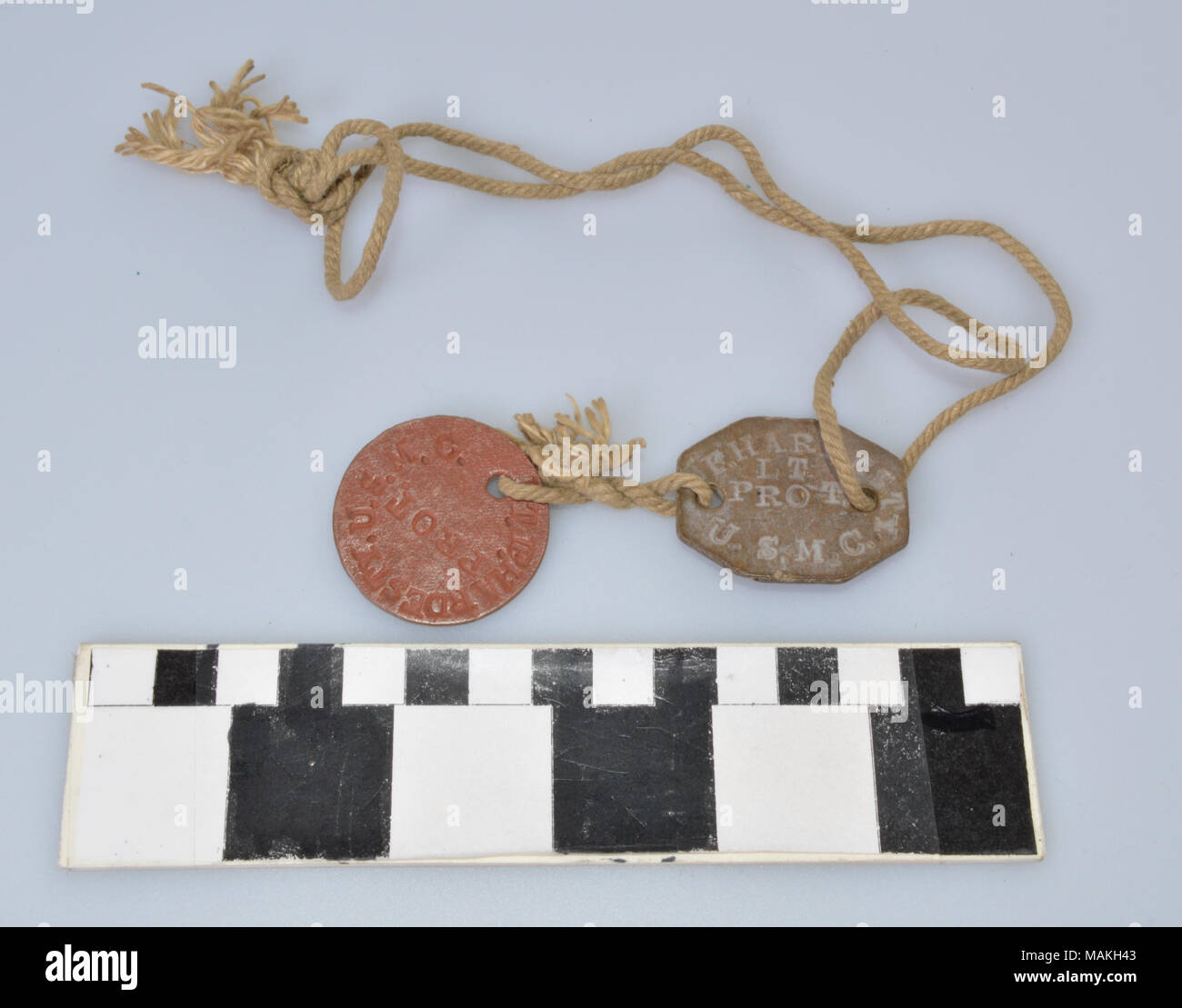 Set of dog tags issued to John Frank Hardesty by the British Military during his service in the U.S. Medical Corps and Seaforth HIghlanders in World War I. The tags are made of a vulcanized asbestos fiber and are on a thick string. They feature Hardesty's religion (PROT or Protestant) and rank of Lieutenant, which mean they were issued early in his service. Title: World War I British Dog Tags of John F. Hardesty  . after 1917. Stock Photo