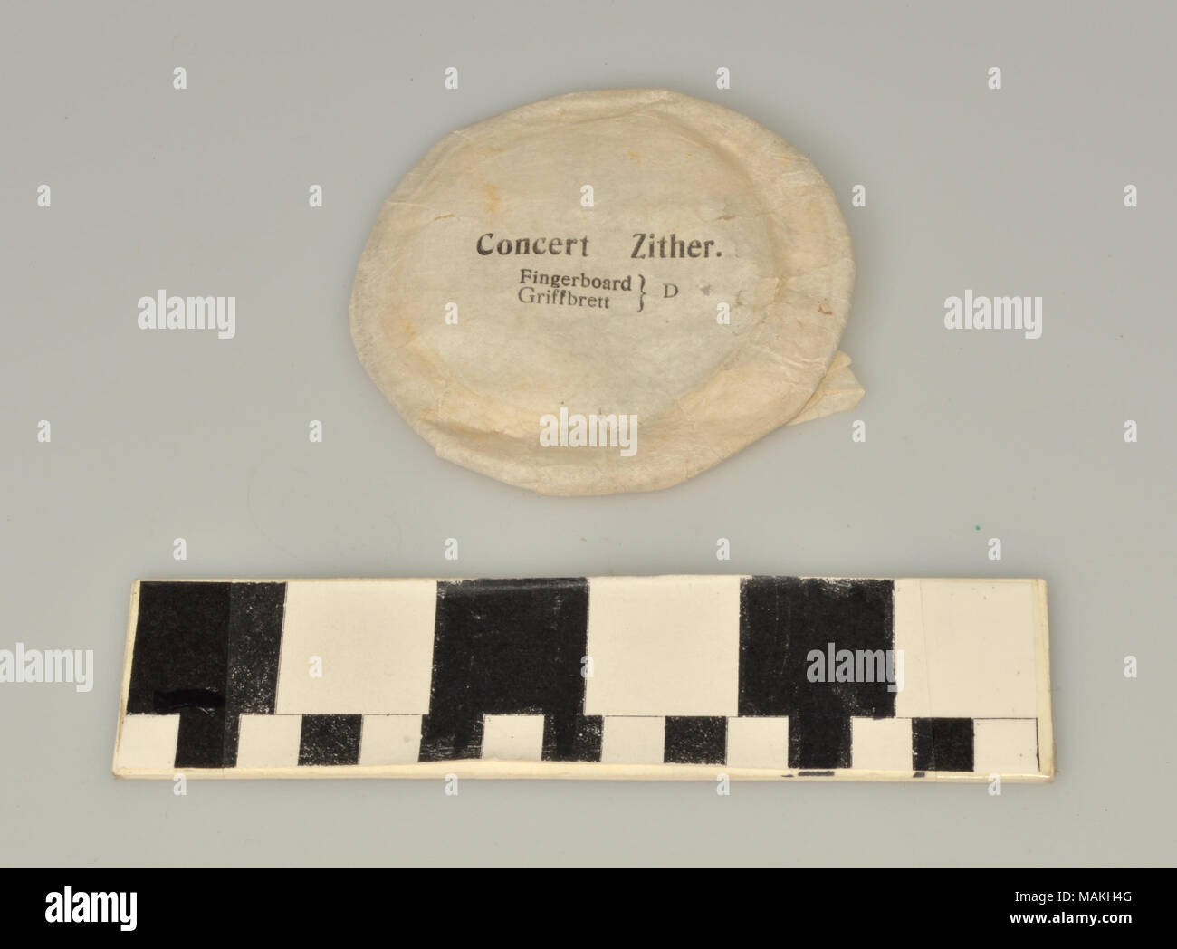 Zither String Replacement Eight metal replacement zither strings in tissue paper wrappers, and ...