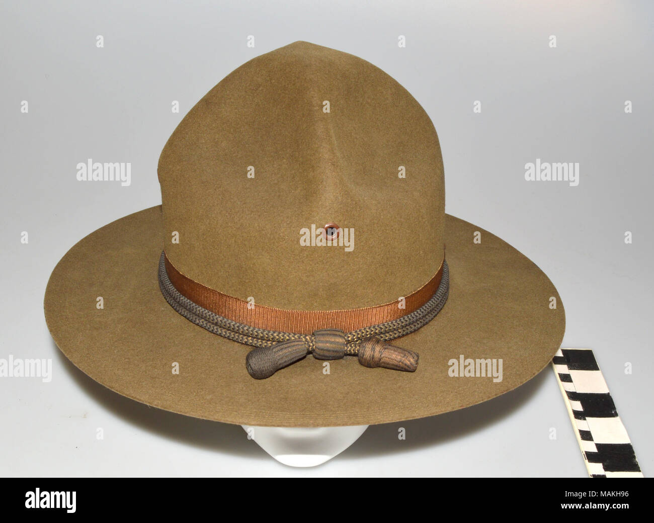 Olive drab Montana Peak military campaign hat. Tan felt hat with wide circular brim and four pinched peaks on the crown. Hat cord around brim is black and gold which signifies a commissioned officer. Title: US Military World War I Campaign Hat  . between 1911 and 1917. Stock Photo